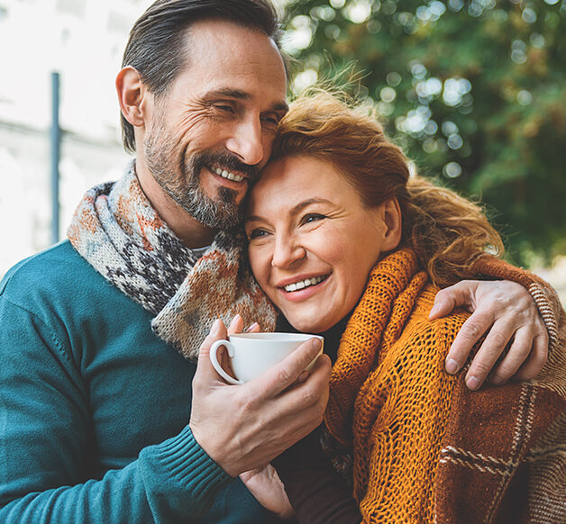 man with his arm around his wife