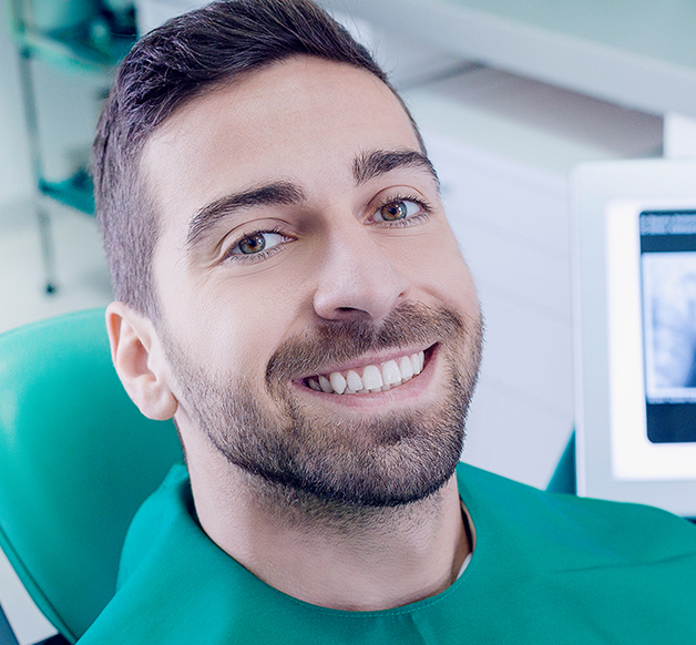 smiling man at the dentist